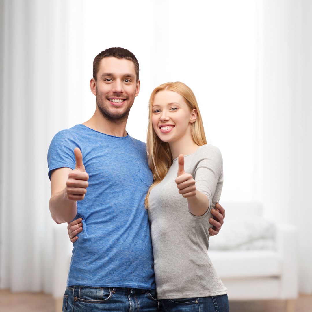 Couple giving a thumbs up